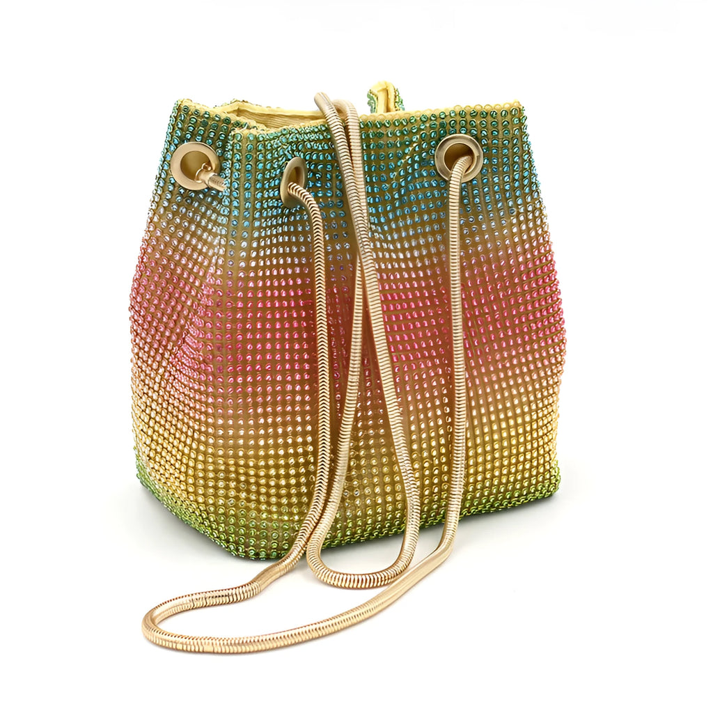 Sparkling rhinestone bucket bag with drawstring closure on a soft texture.