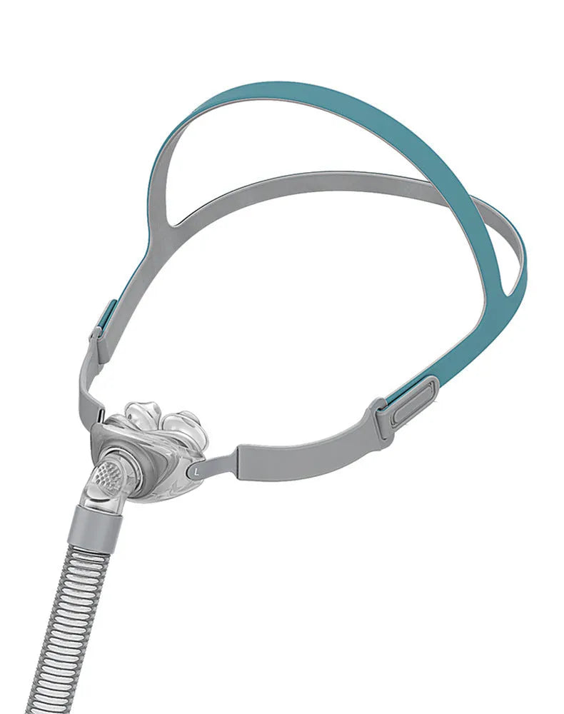 Ventilator nasal pillow mask kit showing silicone cushion, nose pad, and adjustable headband on a white background.