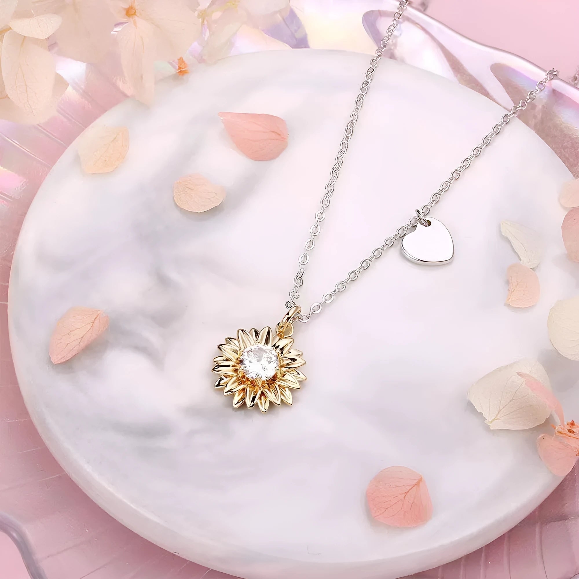 925 sterling silver sunflower necklace with daisy petal details on an adjustable cross chain.