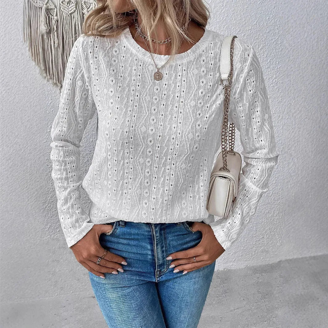 White loose fit long sleeve round neck polyester T-shirt laid flat.