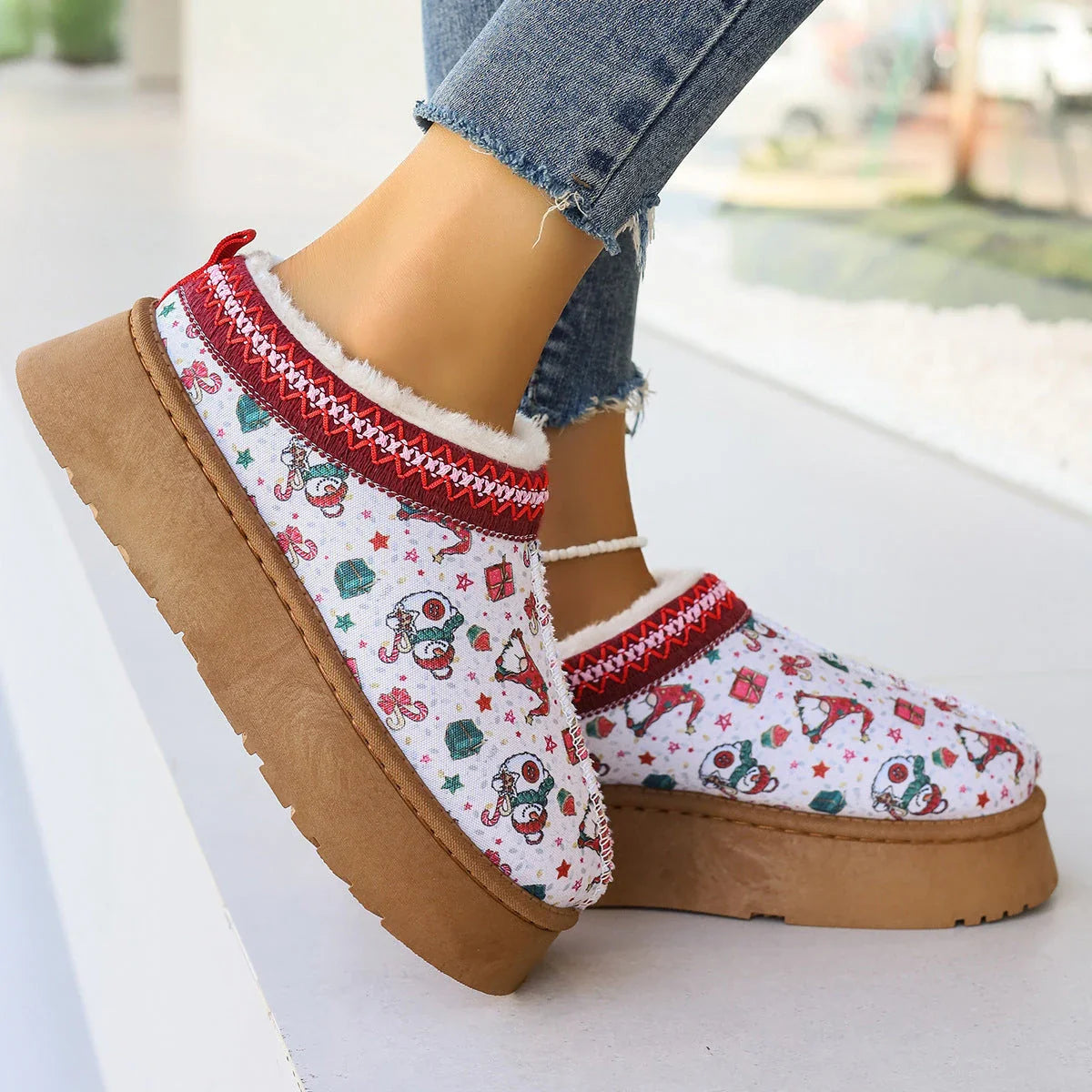 Women's festive plush-lined winter ankle boots with Christmas print, perfect for adding warmth and style to your winter wardrobe.