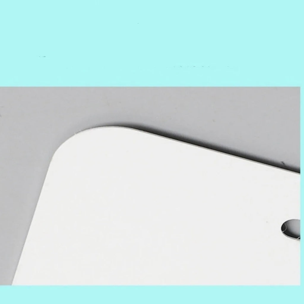 White aluminium licence plate blank sheet measuring 30.3 by 15 centimetres.