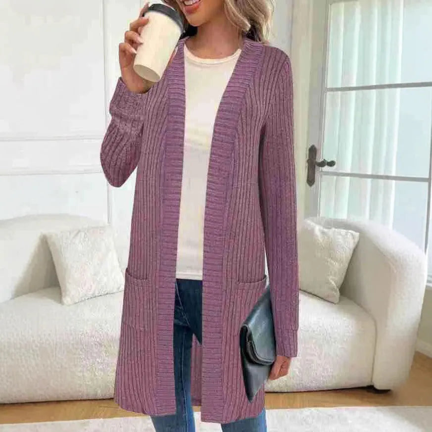 Black loose fit knitted cardigan jacket with long sleeves and side pockets on a mannequin.