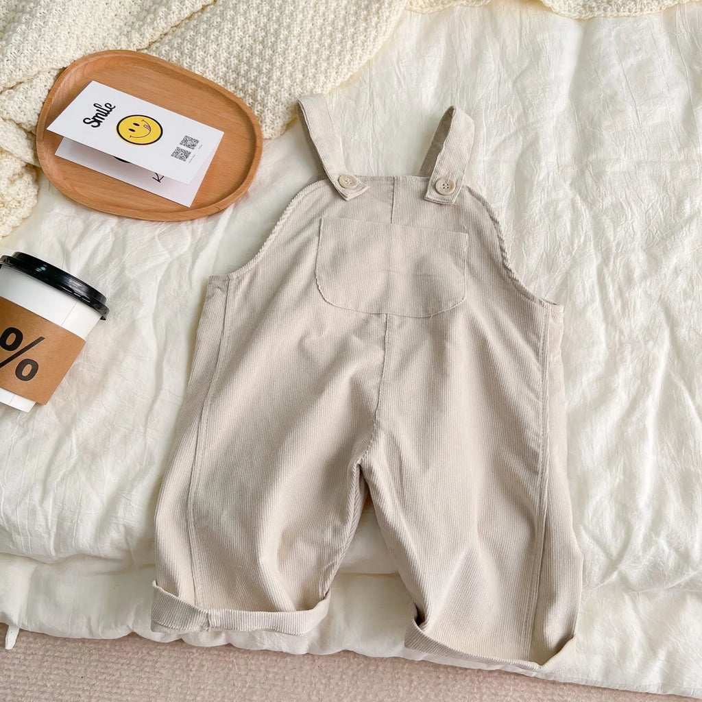 Infant plaid corduroy overalls in creamy-white with large pockets and double breasted closure