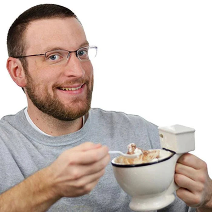 Humorous toilet-shaped ceramic coffee mug with handgrip, perfect for gag gifts or unique decor