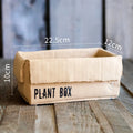 Cement brown paper box style flowerpot with drainage holes for indoor plants.