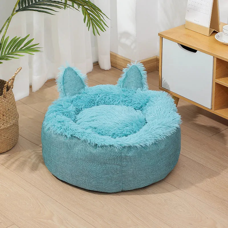 Blue faux fur plush enclosed cat bed house on a wooden floor