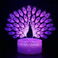 Acrylic USB touch night light with colourful crack base design on a bedside table.