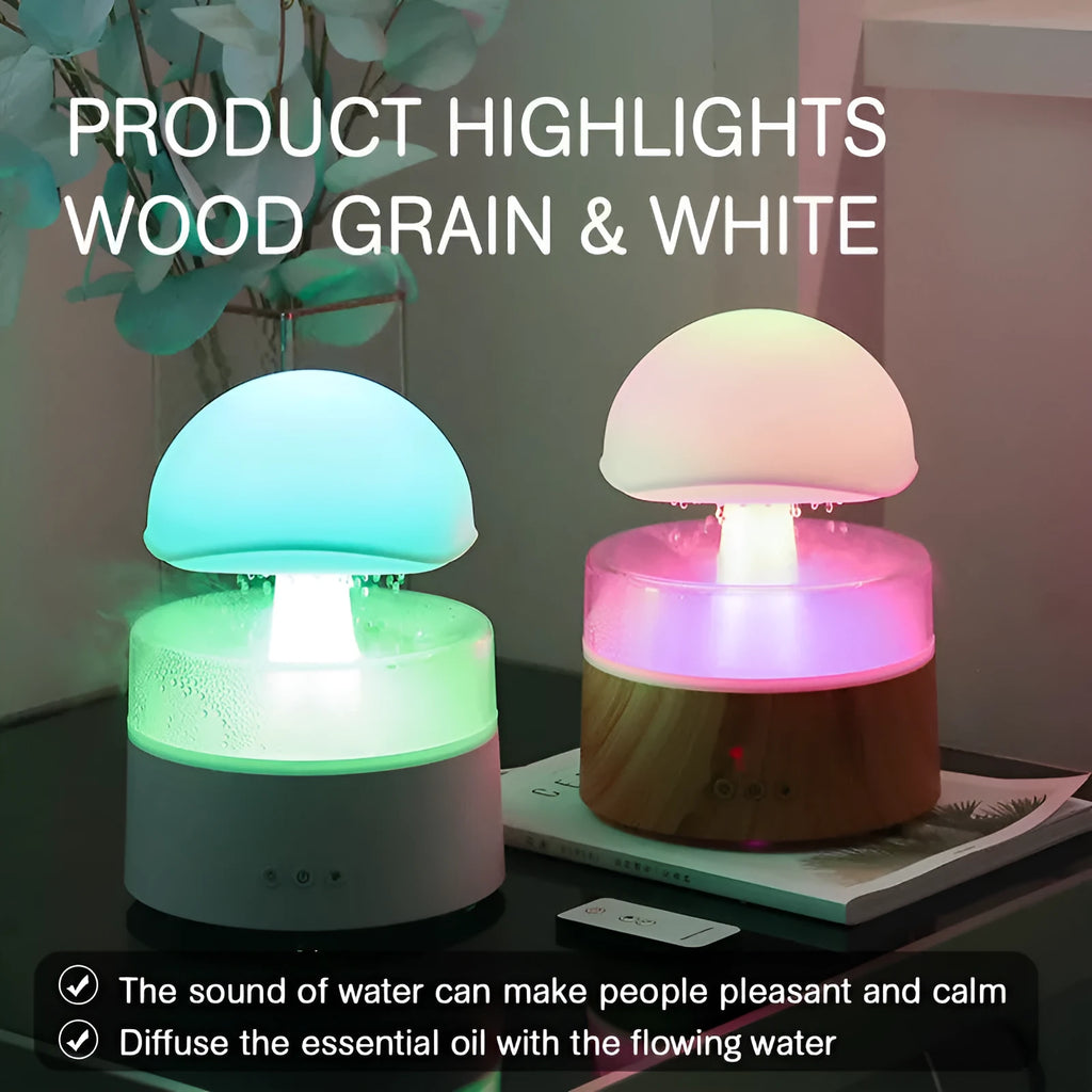 White rain cloud shaped ultrasonic humidifier and aromatherapy diffuser with coloured lights on a wooden table.