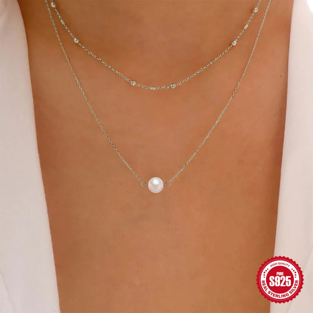 S925 sterling silver necklace with double-layer twin pearl pendant on a ball bead chain, shown in gold colour.