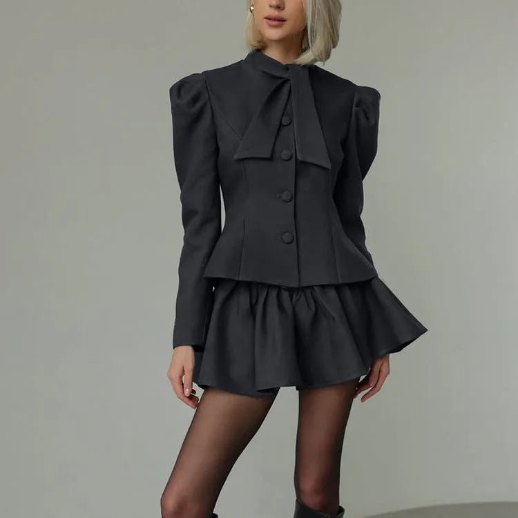 Women's gray bow tie long sleeve suit top and short skirt two-piece set on model