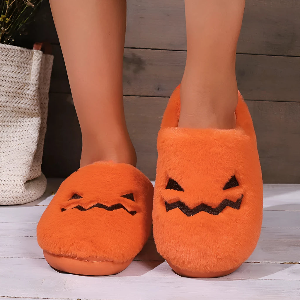 Orange Halloween pumpkin slippers with plush interior and non-slip PVC sole