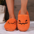 Orange Halloween pumpkin slippers with plush interior and non-slip PVC sole