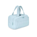 Large fluffy travel toiletry bag in creamy-white, shown wide open with dimensions 29.97 by 18.54 by 21.08 cm.