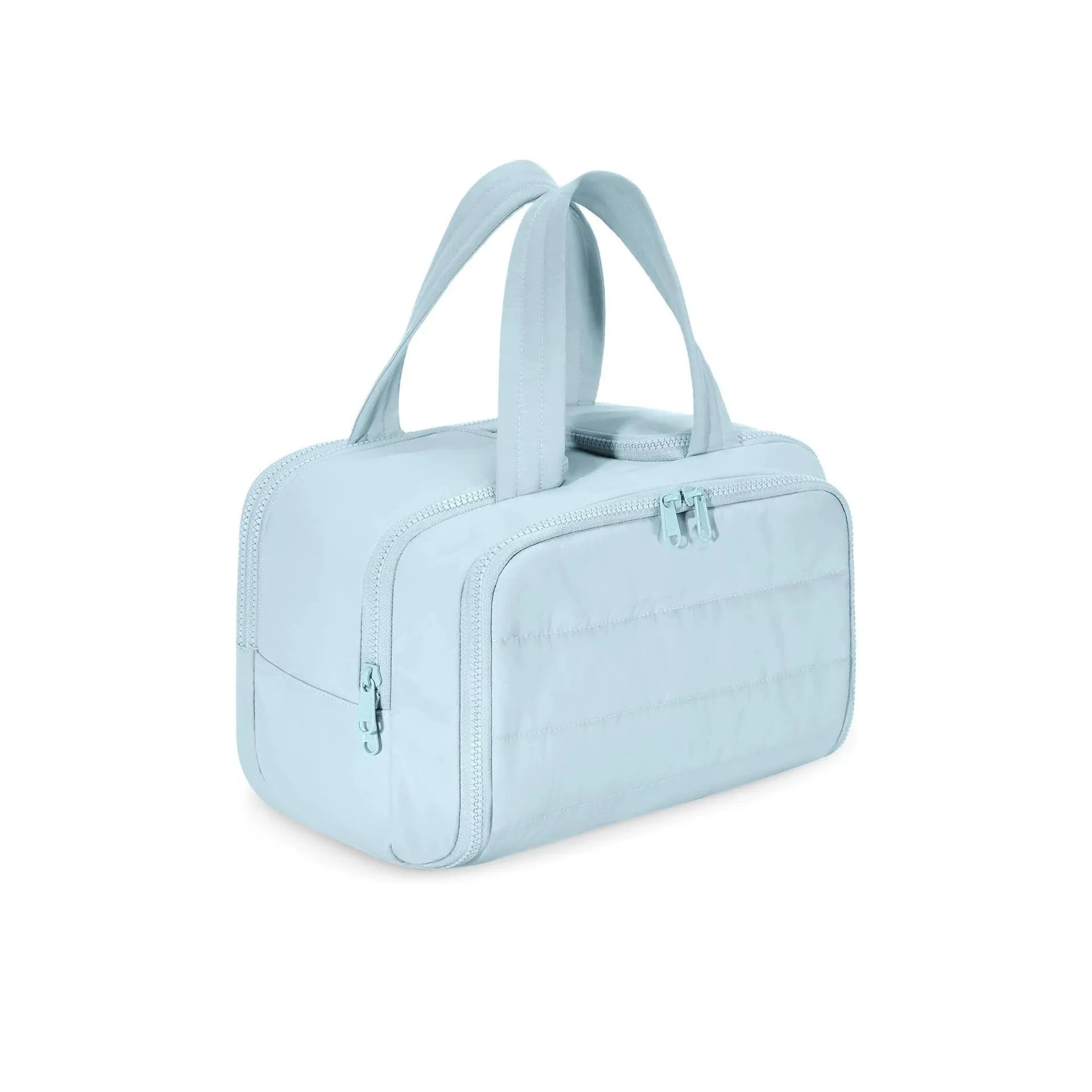Large fluffy travel toiletry bag in creamy-white, shown wide open with dimensions 29.97 by 18.54 by 21.08 cm.