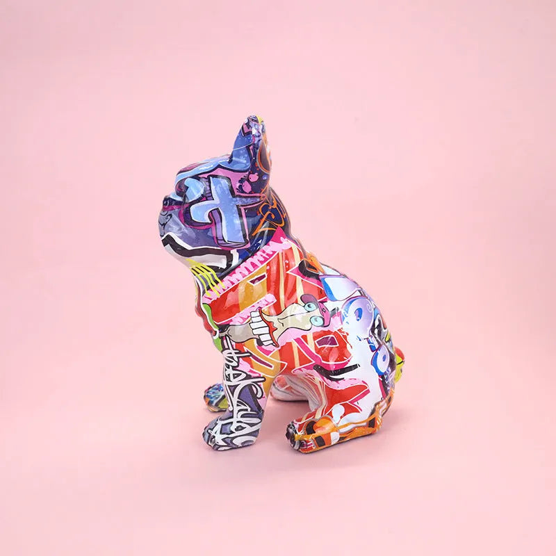 Modern simple French bulldog resin statue in graffiti colour finish on a plain background.