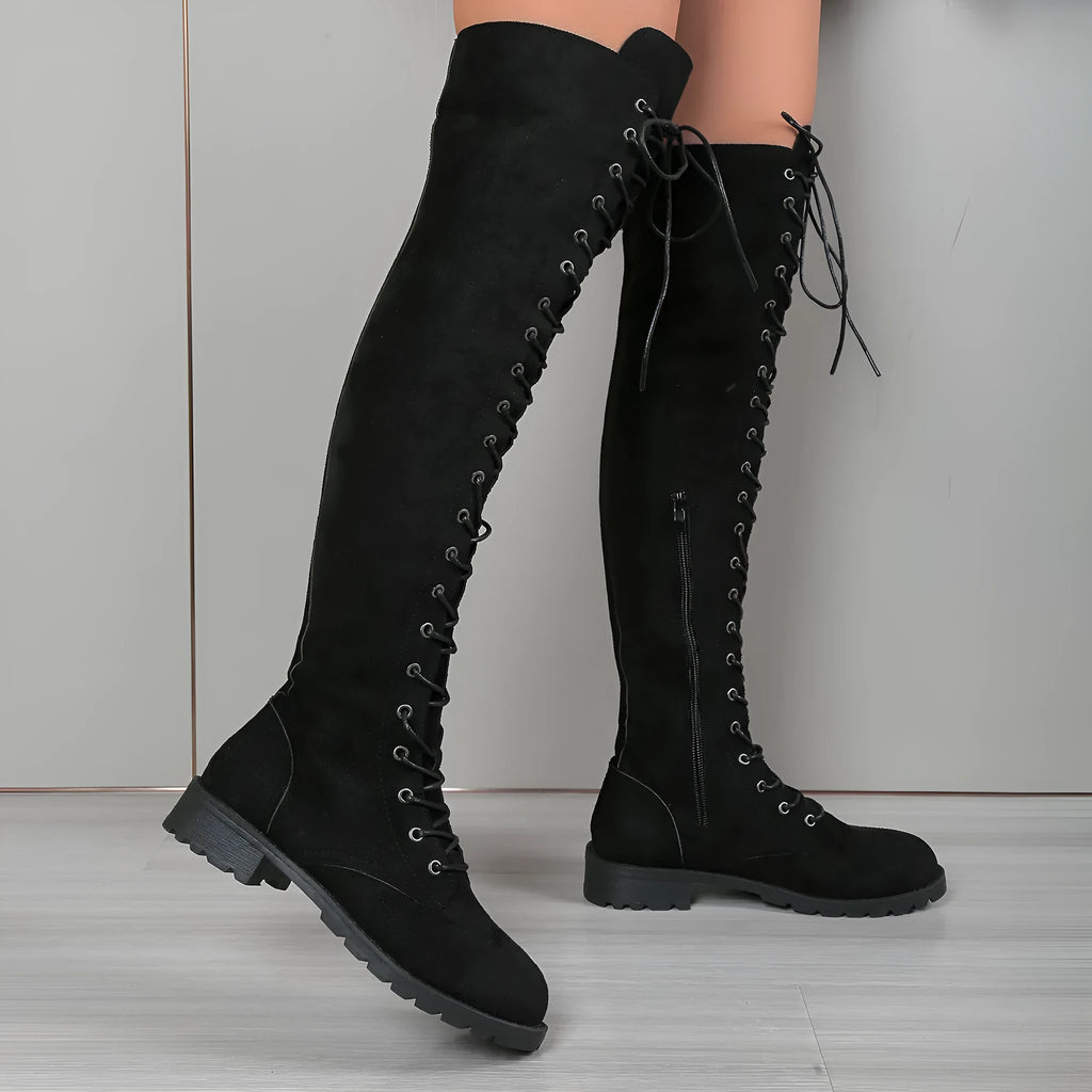 Women's black lace-up over-the-knee boots with flat heel and decorative stitching on a synthetic PU upper.