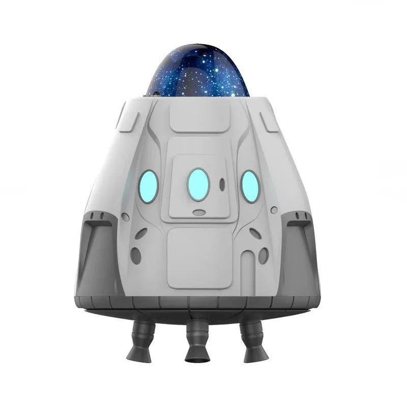 White capsule-shaped Bluetooth northern lights starry sky ambience light projector with remote control.
