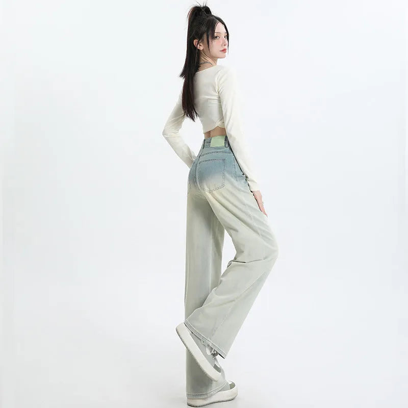 Women's gradient blue straight-leg wide leg cotton denim trousers laid flat.