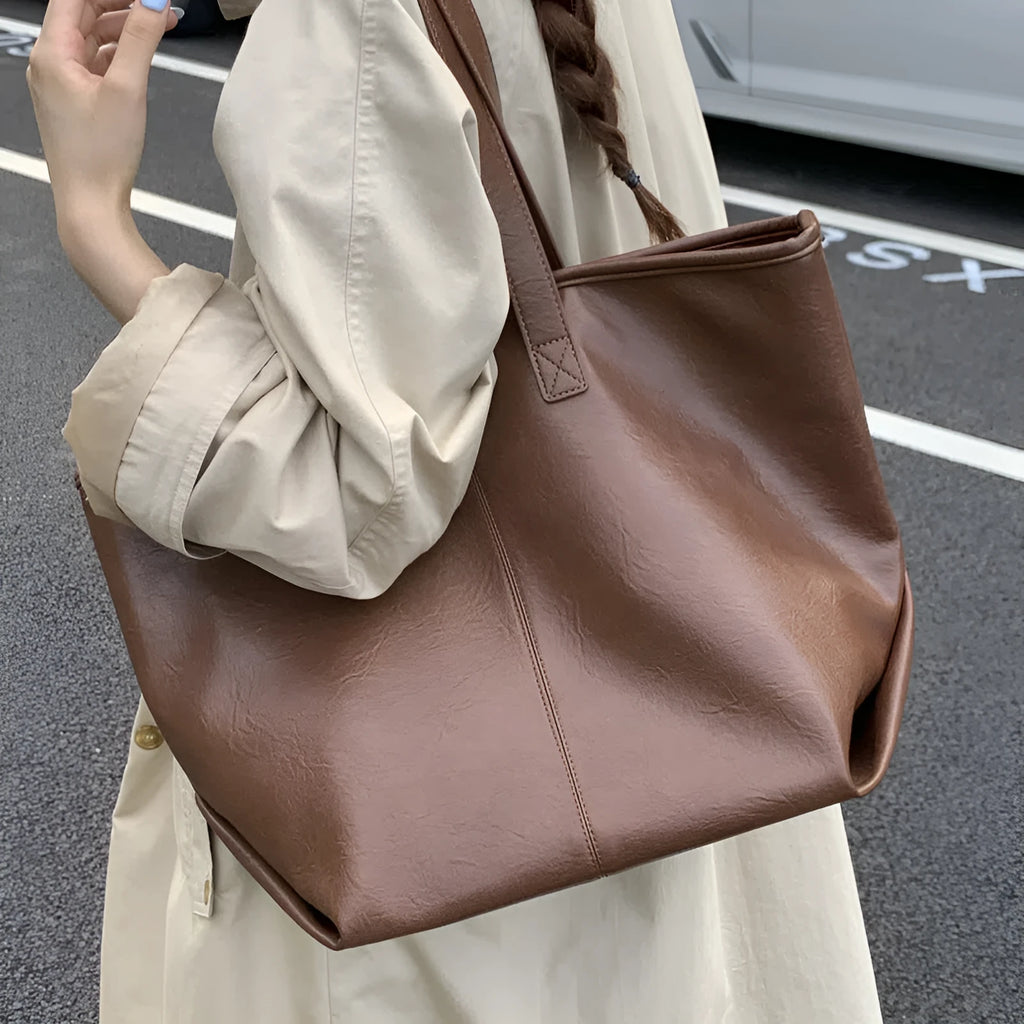 Fashionable large-capacity vintage tote bag in soft PU with stitched seams, horizontal shape, double straps