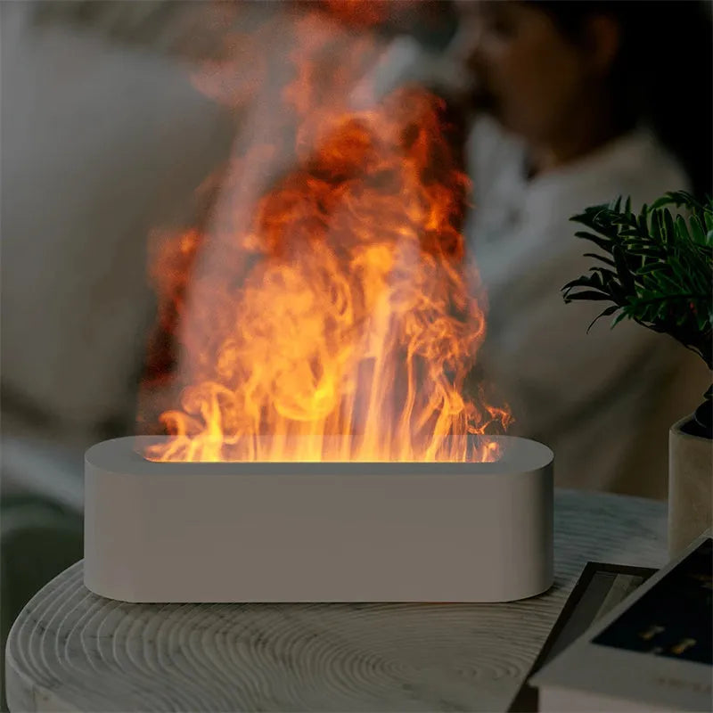 White square ultrasonic flame aroma diffuser with LED lights on a wooden table.