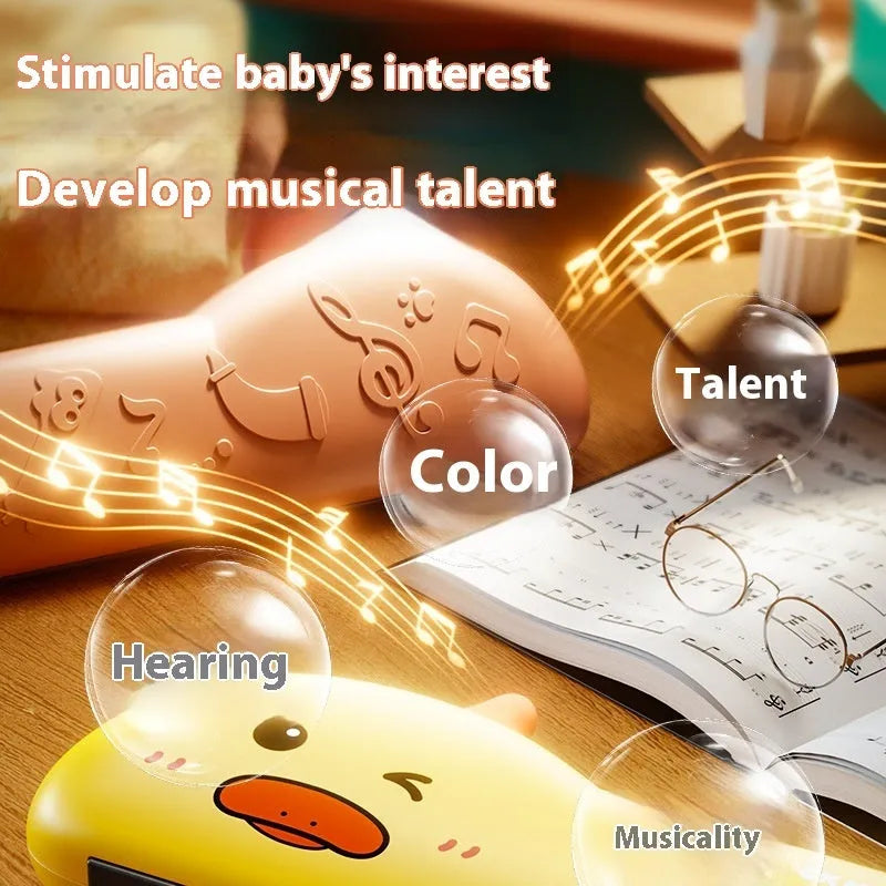 Cartoon plastic whistle musical instrument for children, green dinosaur colour, on white background