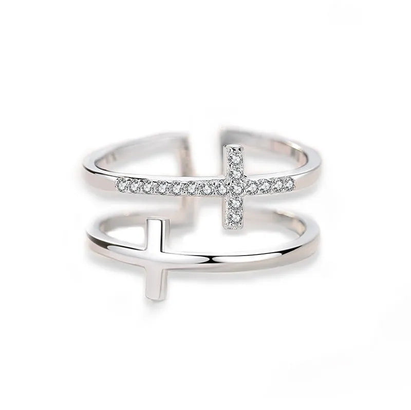 Adjustable double cross geometric ring in copper with sterling silver and zircon stone inlay.