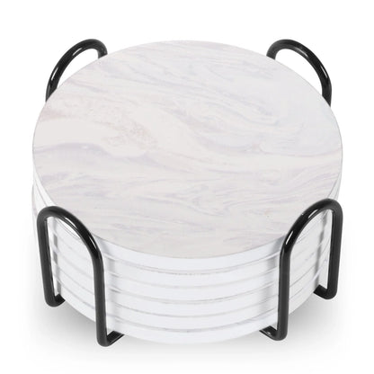 Set of 6 round ceramic coasters with metal stands and cork bases on a wooden table