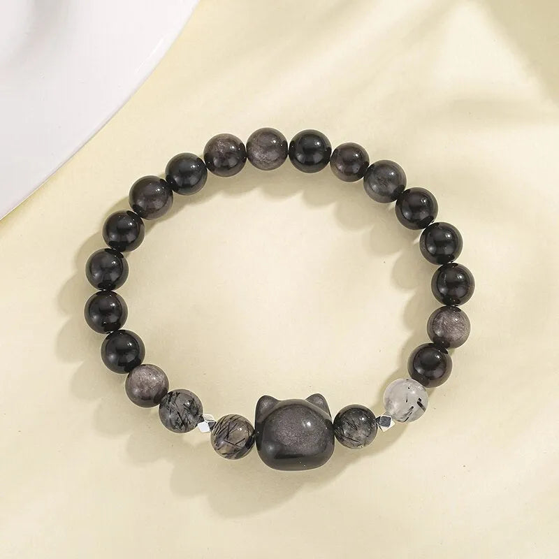 Natural obsidian cat couple bracelet with electroplated silver finish showing cat modelling detail