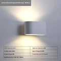 Simple Nordic plaster wall lamp with ABS shade mounted on a light-coloured wall