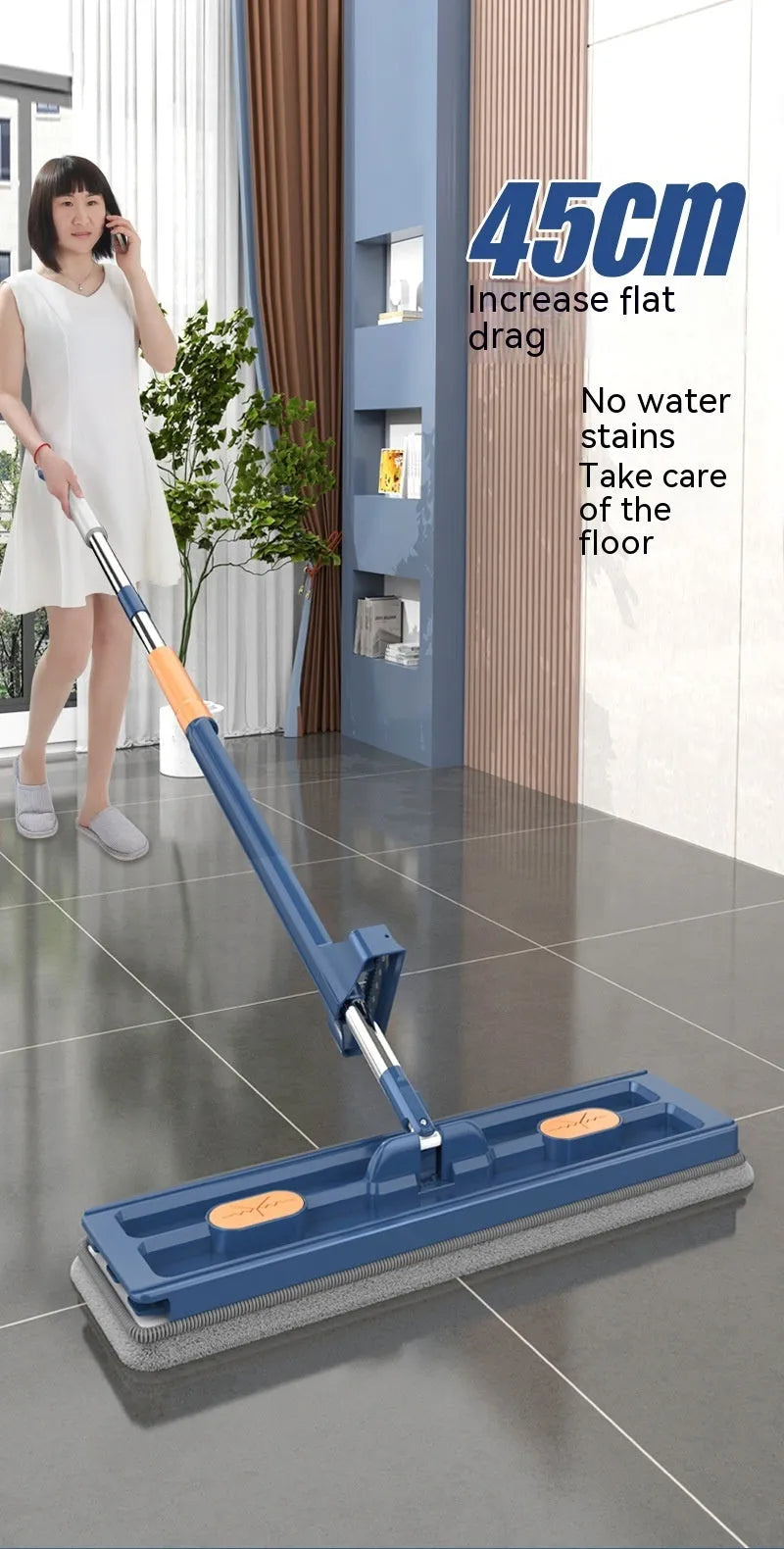 Large flat mop with long stainless steel handle, blue rotating head, and integrated scraper on a hardwood floor.