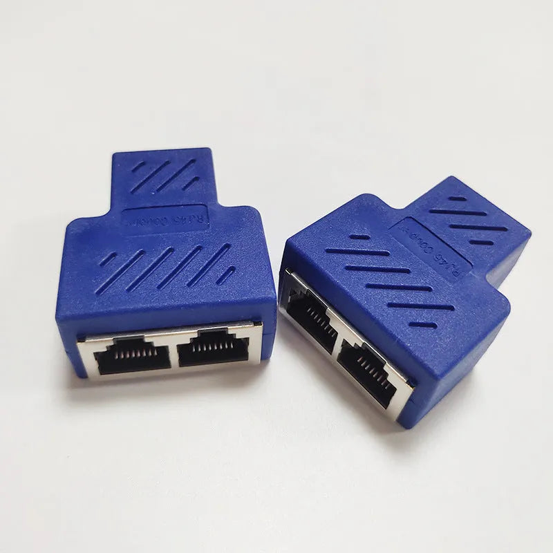White RJ45 three-way network cable splitter adapter with one input and two output ports.