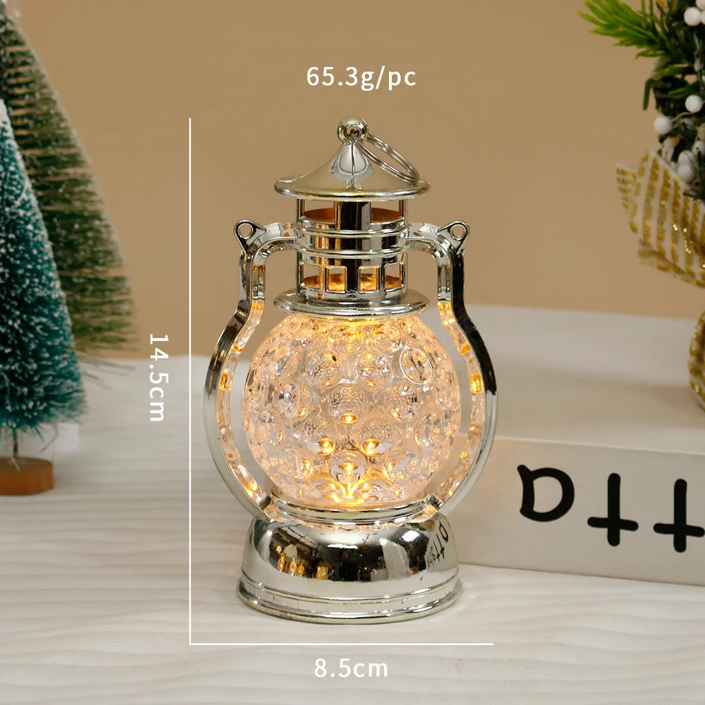 Creative retro-style oil lamp LED night light in gold or silver finish on a dark surface