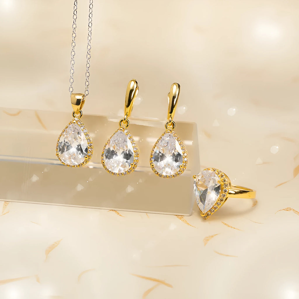 Drop-shaped zircon non-fading three-piece jewellery set gold plated with mixed gem inlaid pendant in emerald gold colour on white background