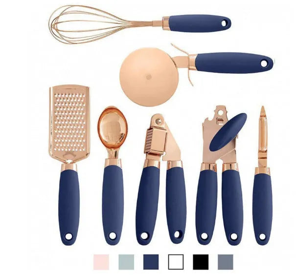 7-piece stainless steel kitchen tool set with copper plating in assorted colours on a countertop.