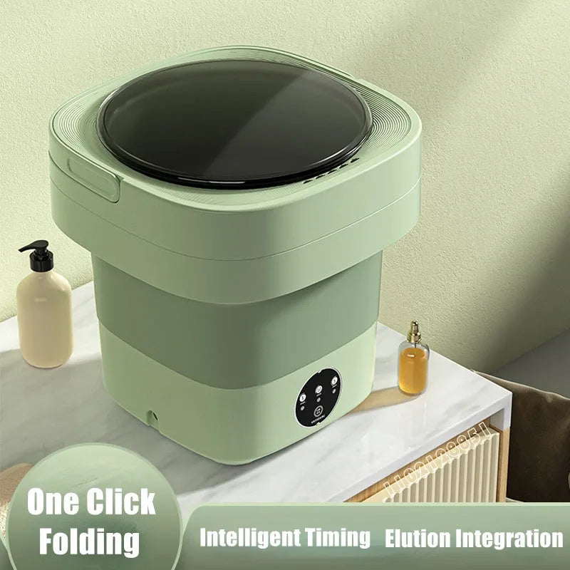 Green foldable mini portable washing machine with drain pipe and basket on a white background.