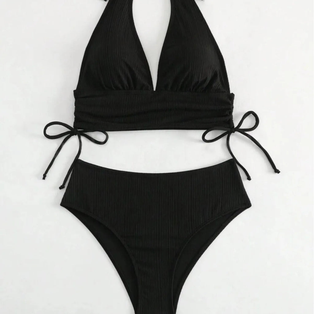 Women's black lace-up halter bikini set with matching briefs on white background