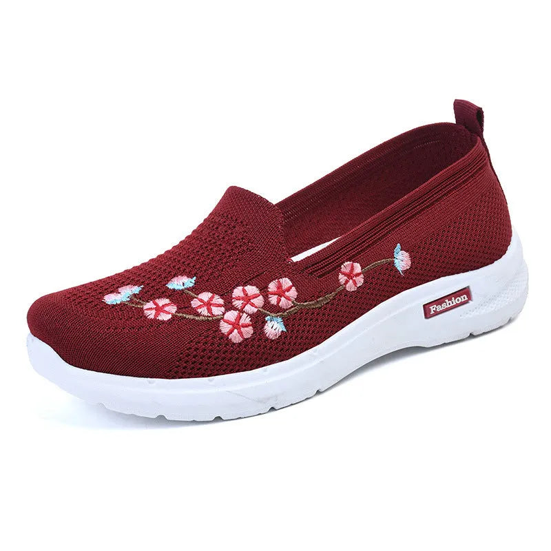 Women's embroidered flywoven casual flat pumps in wine red, shown on a white background.