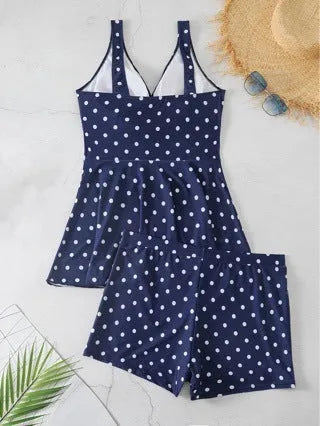 Blue polka dot print women's plus size bikini swimsuit on a hanger