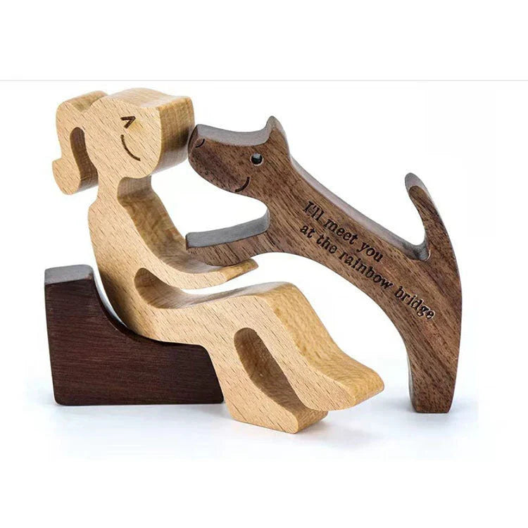 Handcrafted wooden dog sculpture featuring a man and his loyal canine companion