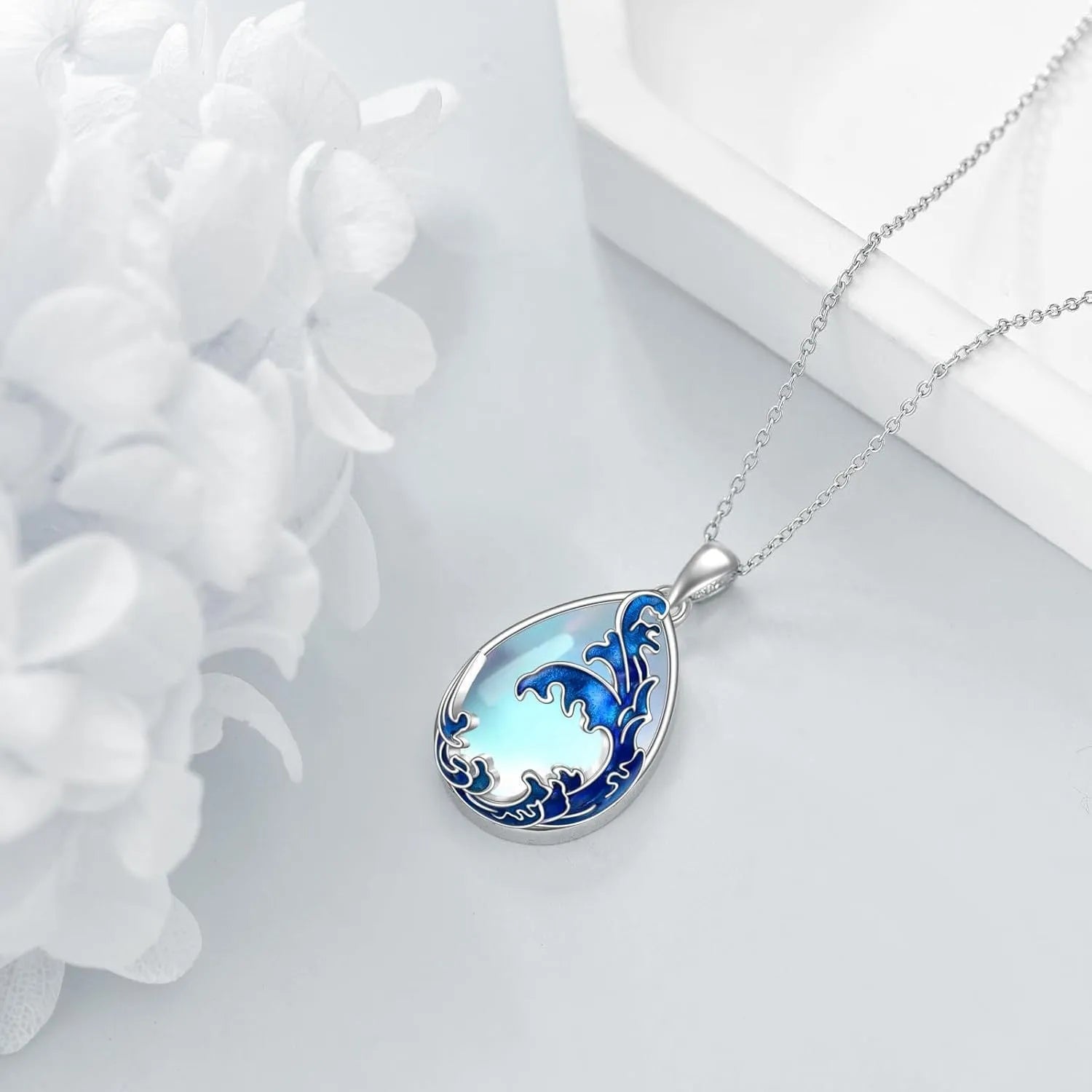 Moonstone blue alloy heart pendant on a women's necklace.
