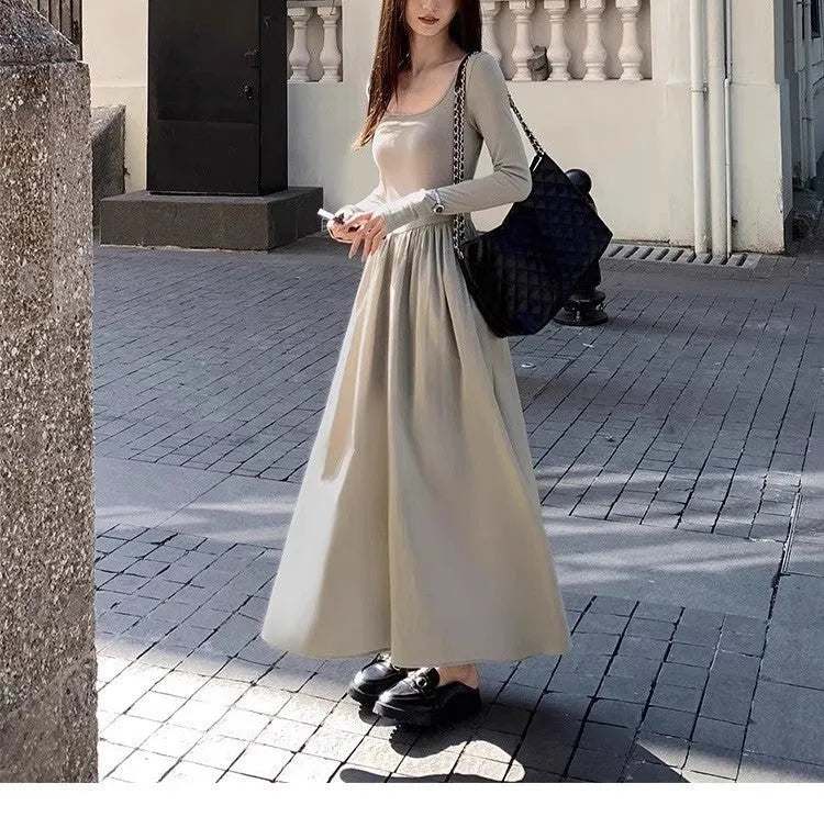 Black knitted square collar dress with long sleeves and an A-line skirt on a mannequin.