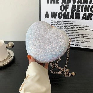 Heart-shaped shiny metal clutch bag with chain strap in various colours