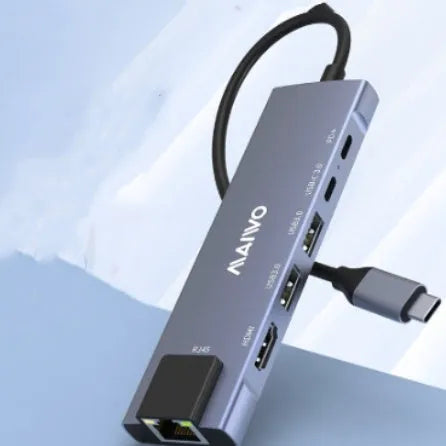 Aluminium alloy Steam Deck six-in-one docking station with USB-C cable and labelled ports for HDMI, Ethernet, and USB.