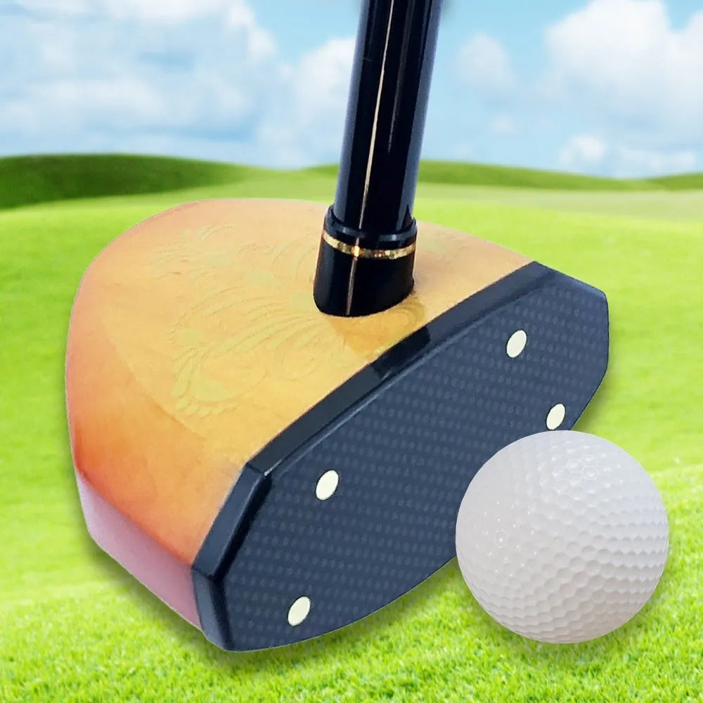 Maple head green golf training club with carbon rod body on a practice mat