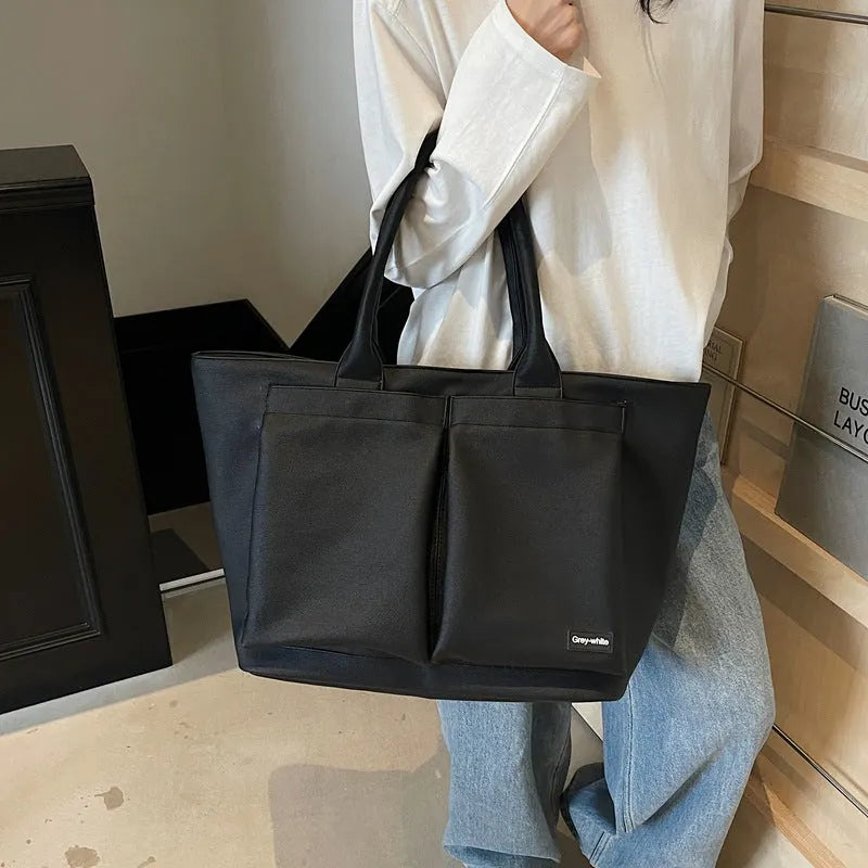 Lightweight sporty shoulder bag in PU material, shown in green colour