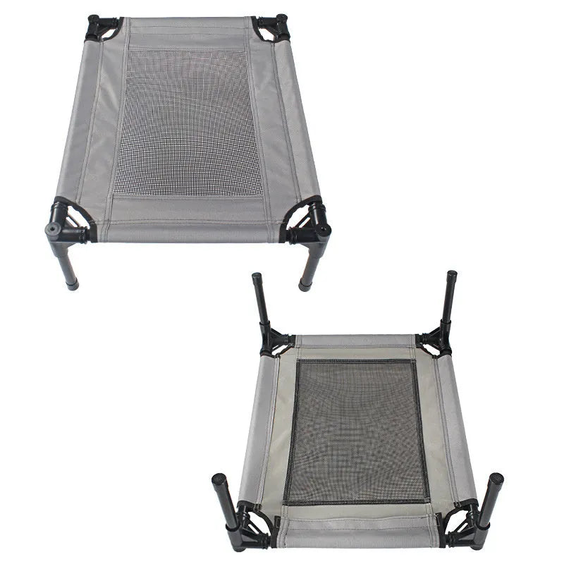 Black portable outdoor dog bed with steel frame and removable Oxford cloth cover, shown on grass.
