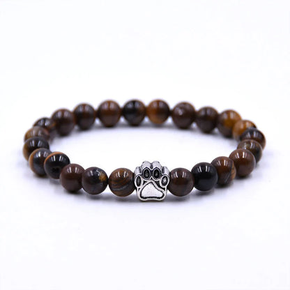 Natural stone dog paw bracelet featuring tiger eye and volcanic stone in a unisex design