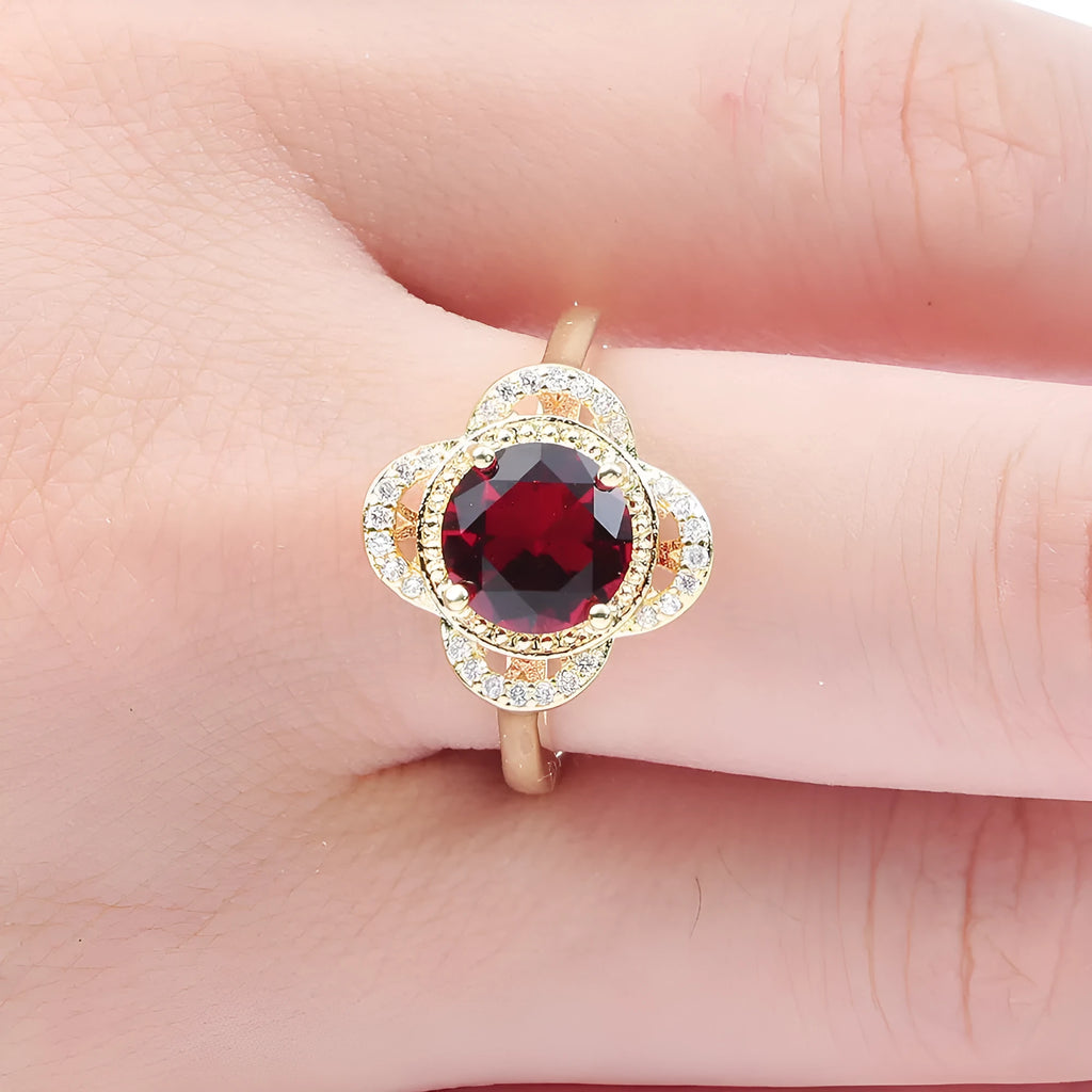 Copper ring with a fruit-shaped zircon stone inlay on a finger.
