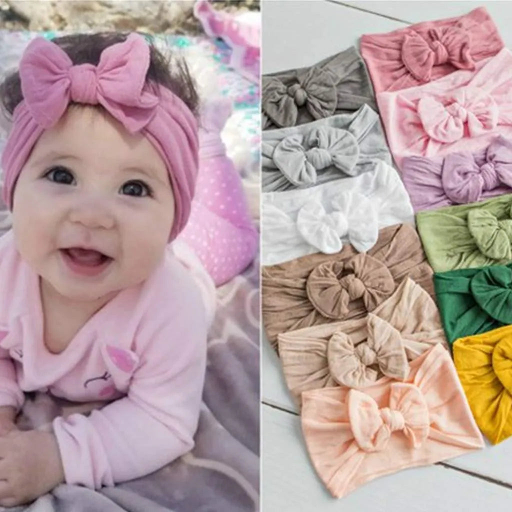 Super stretchy soft knot headband with bow for baby girls in 22 colours, made from nylon and spandex